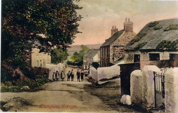 Undated copy of a photograph looking down Main Street Llangwm Pembrokeshire with a group of children (unnamed) standing across the road